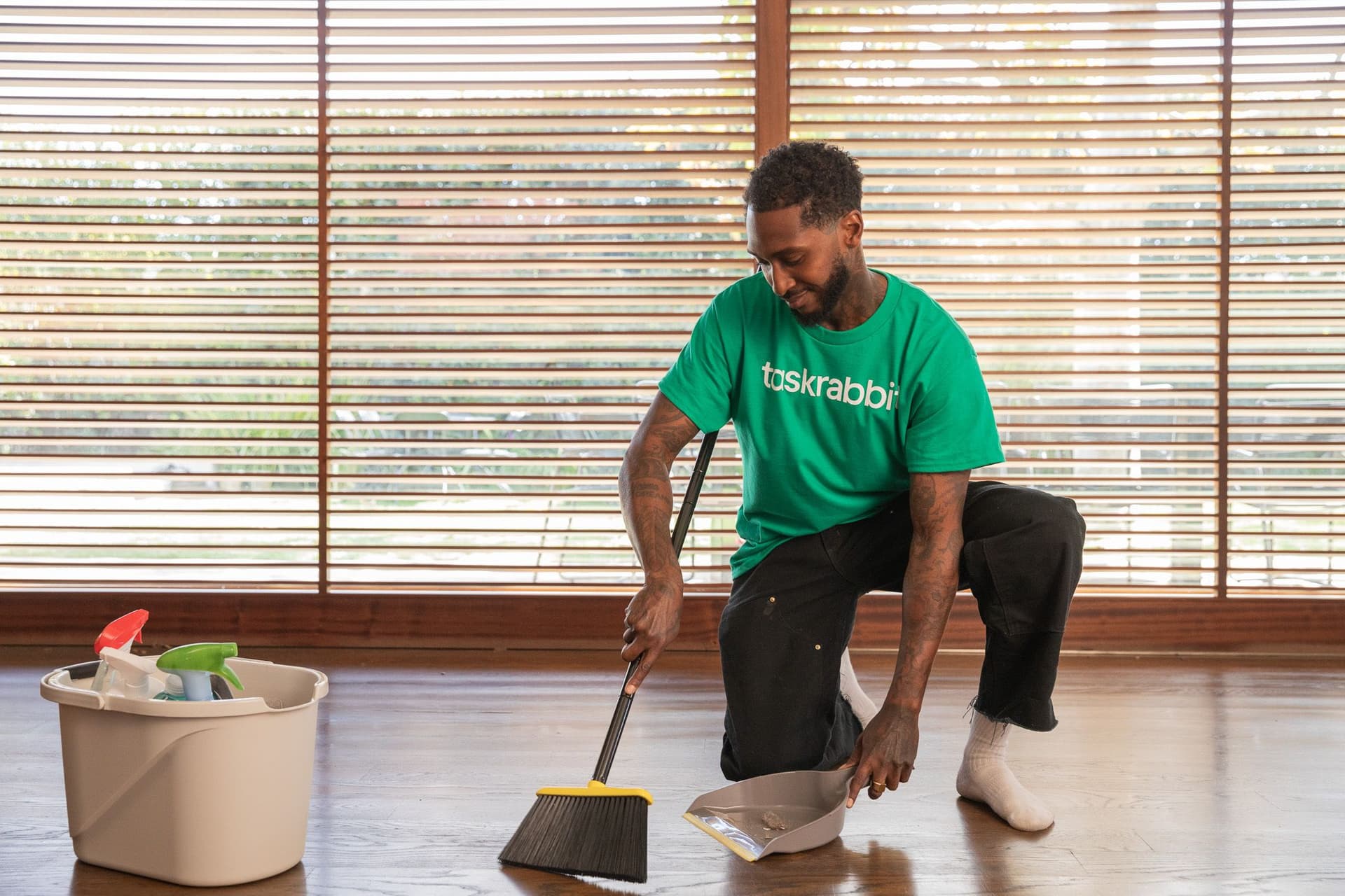 Display ad for taskrabbit: an employee is cleaning out a space.